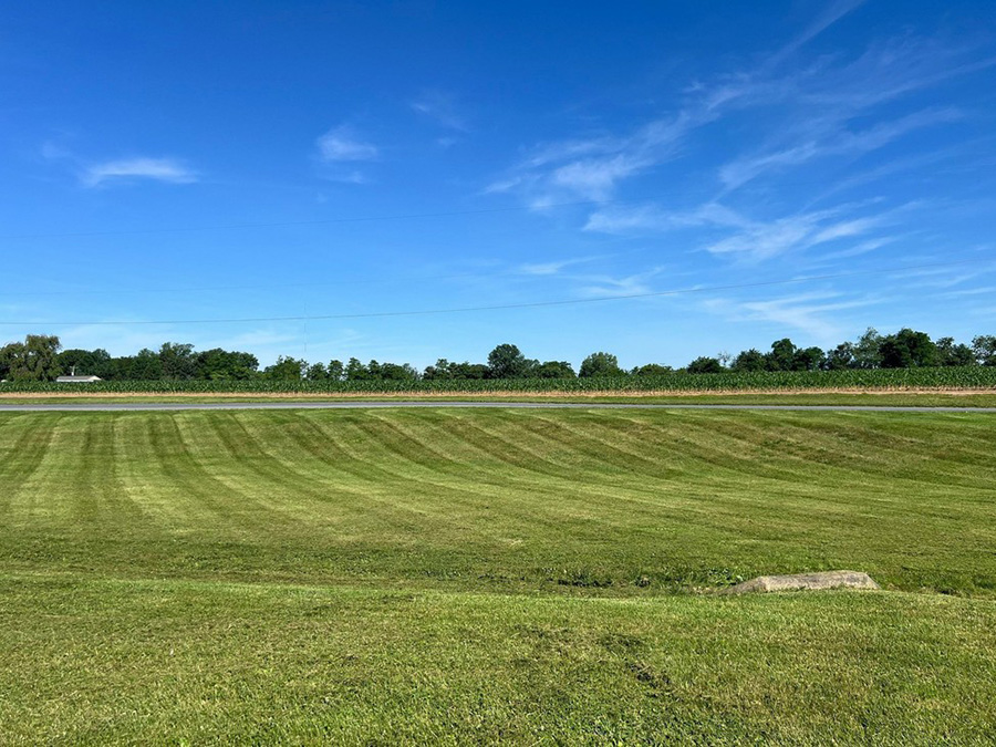 Professional lawn mowing results on a property